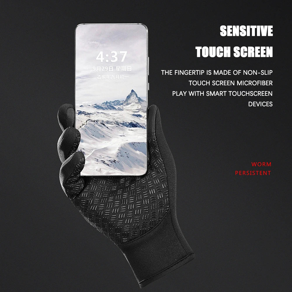 Black glove holding a smartphone with a mountainous landscape on the screen against a black background.